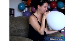 MILF sweetie Mina having fun blowing up balloons Thumb