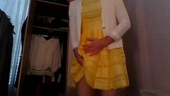 Bridesmaid crossdresser in cute yellow dress and white blazer Thumb